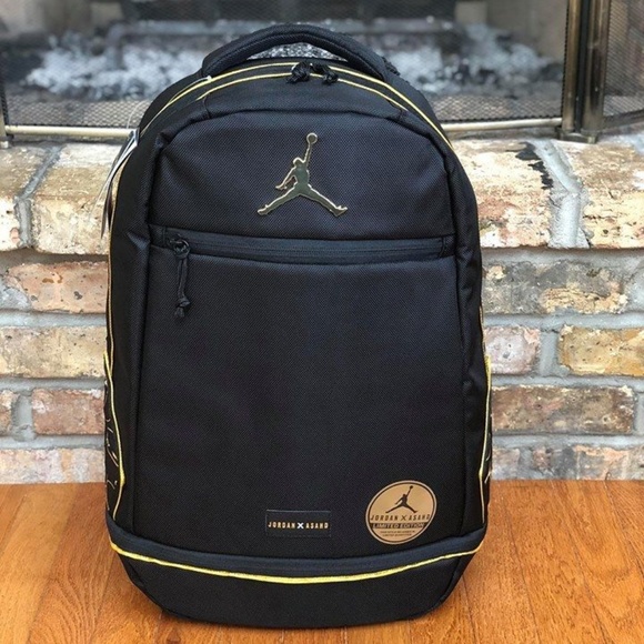 gold and black jordan backpack